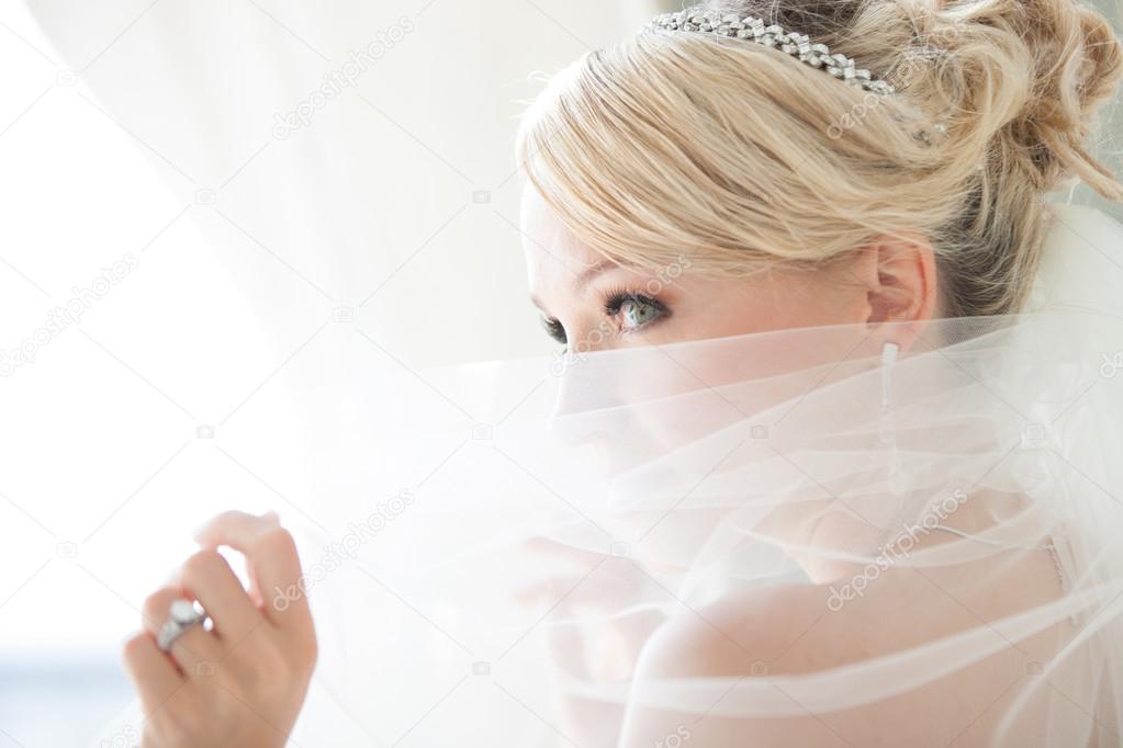 Beautiful Bride Peaking over her Vwil