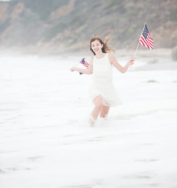 Pretty Teenage Girl with American flags — Stock Photo, Image
