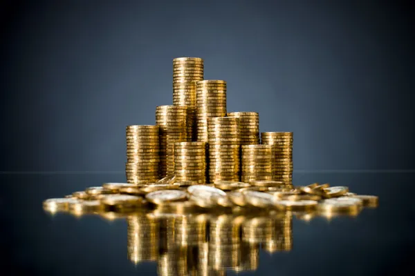 Very many rouleau gold monetary or change coin, on dark background — Stock Photo, Image