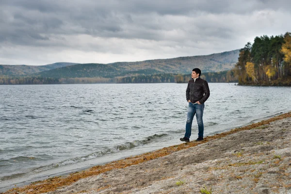 Young guy  on water moorage