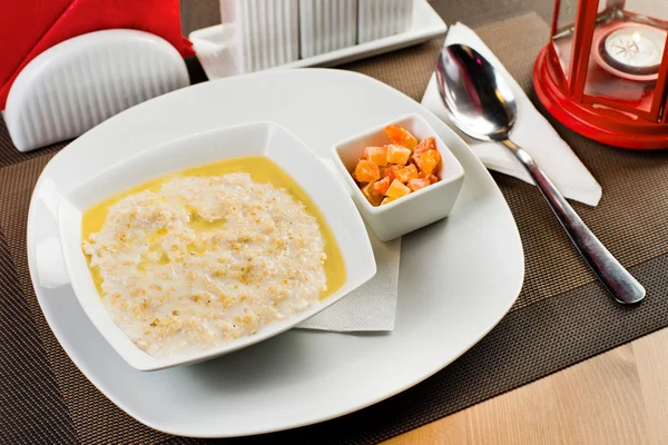 Ceramic white plate with  porridge — Stock Photo, Image