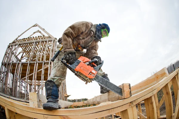 Workman with petrol-powered saw — Stock Photo, Image