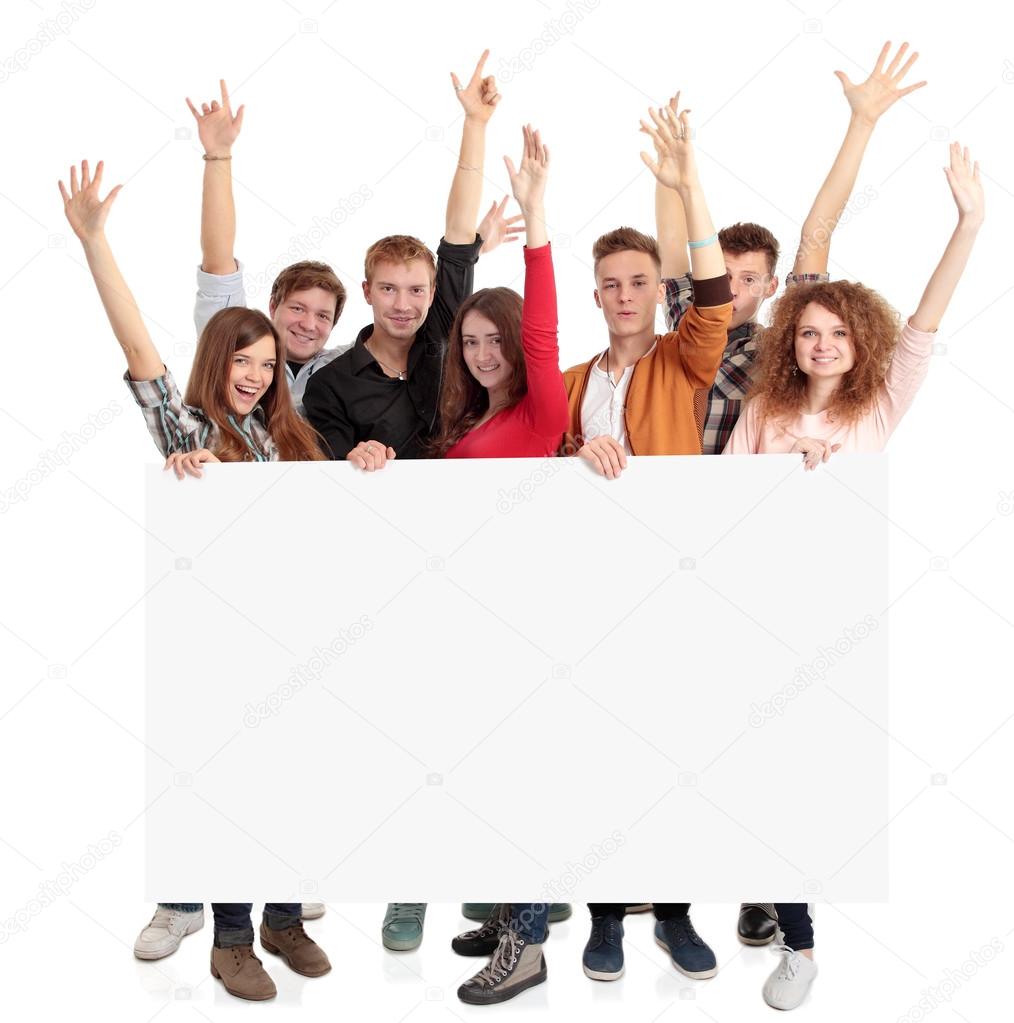 group of smiling friends holding blank banner
