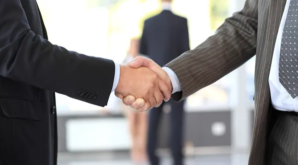 Business men closing deal with a handshake — Stock Photo, Image