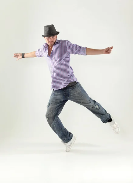 Hip-hop style dancer posing on isolated background — Stock Photo, Image