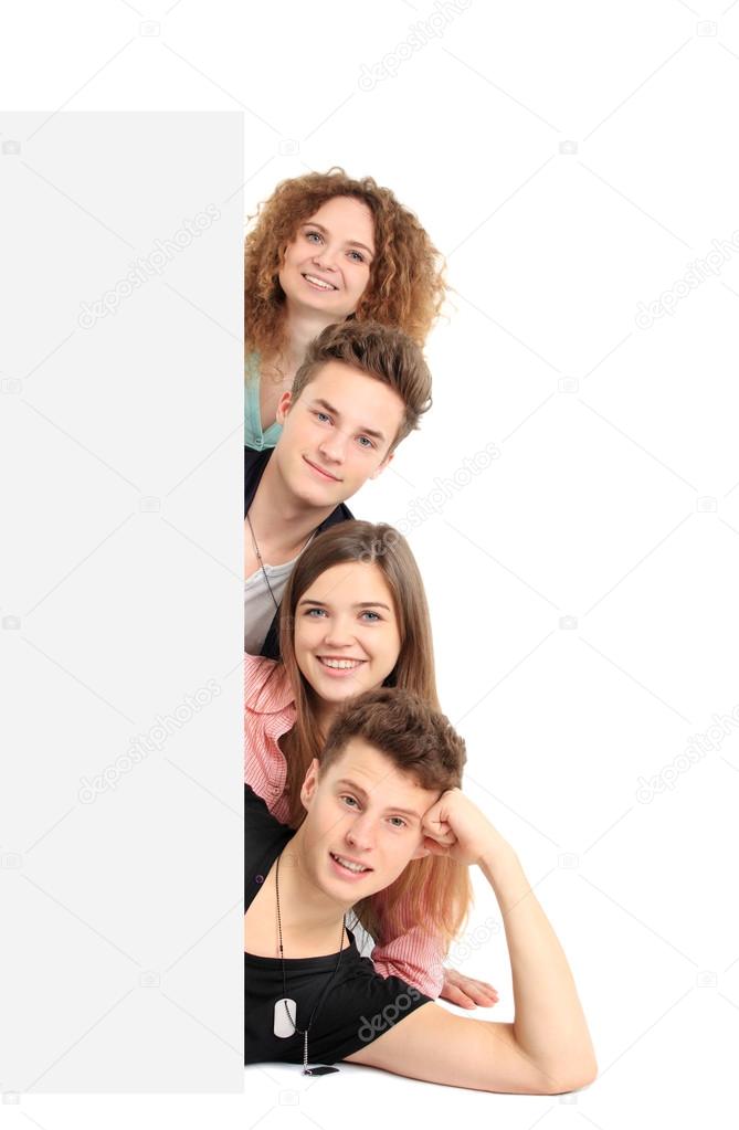 Happy group of with a banner - isolated over a white background