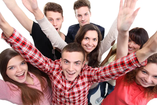 Groupe excité de avec les bras en l'air isolé — Photo