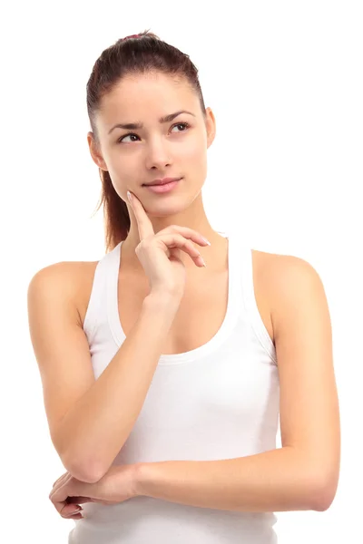 Eine hübsche junge Frau blickt in die Ferne auf weißem Hintergrund — Stockfoto