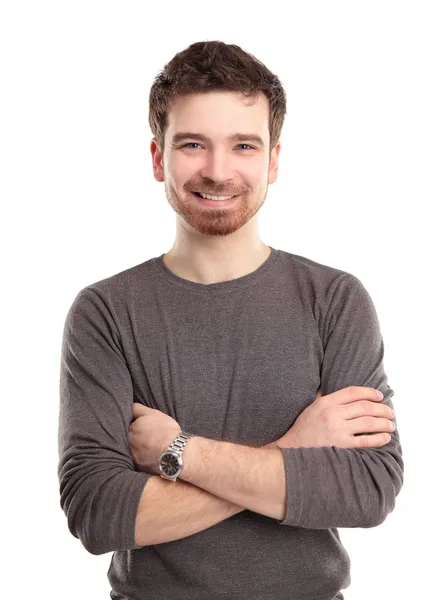 Casual young man looking at camera with arms crossed and satisfaction — Stock Photo, Image