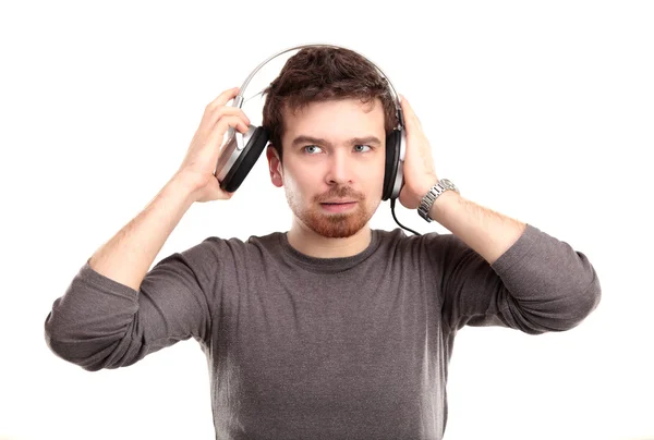 Surprised young man in headphone — Stock Photo, Image