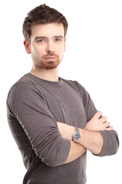 Casual young man looking at camera with arms crossed and satisfaction — Stock Photo, Image