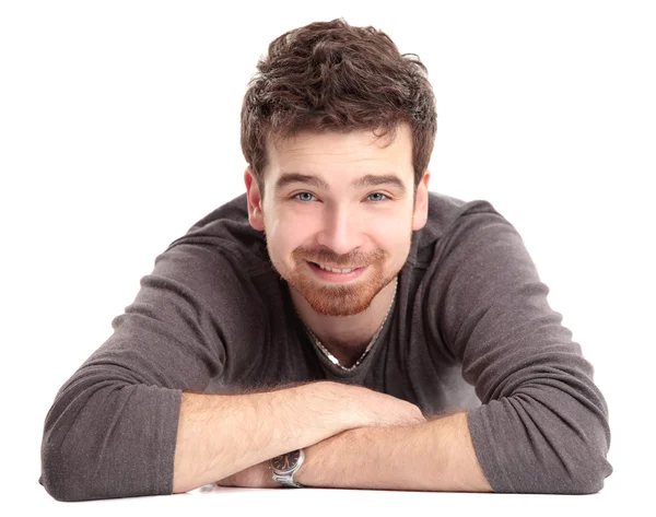 Man lying on floor with arms crossed — Stock Photo, Image