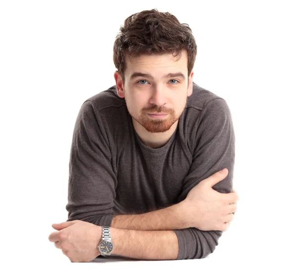 Man lying on floor with arms crossed — Stock Photo, Image