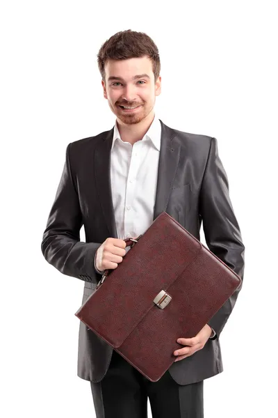 Hombre de negocios con maletín de pie sobre fondo blanco — Foto de Stock