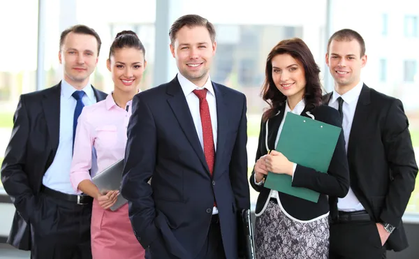 Group portrait of a professional business team looking confidently at camera Royalty Free Stock Images