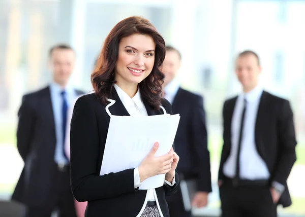 Face of beautiful woman on the background of business — Stock Photo, Image