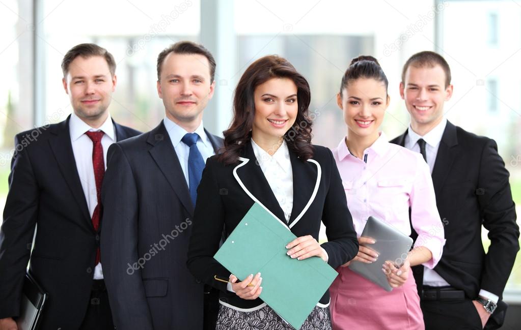 Group portrait of a professional business team looking confidently at camera