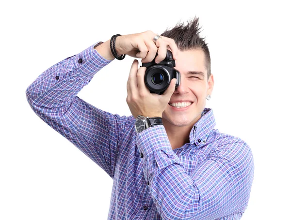 Young man with camera. Isolated over white background — Stock Photo, Image