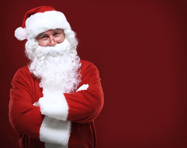 Photo of happy Santa Claus in eyeglasses looking at camera — Stock Photo, Image