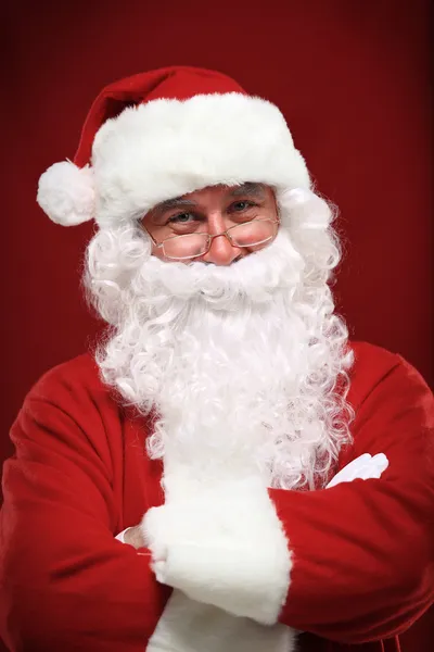 Photo of happy Santa Claus in eyeglasses looking at camera — Stock Photo, Image