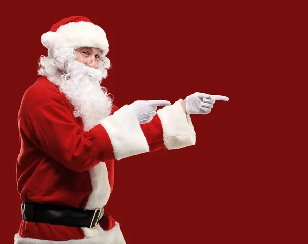 Santa Claus with his arms out in a presenting gesture. Isolated design element Stock Picture