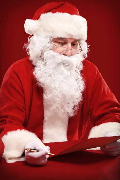 Santa Claus holding Christmas letter — Stock Photo, Image