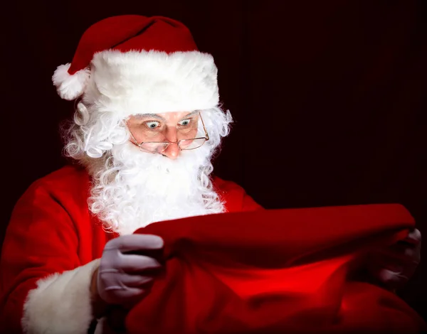 Santa looking into the sack