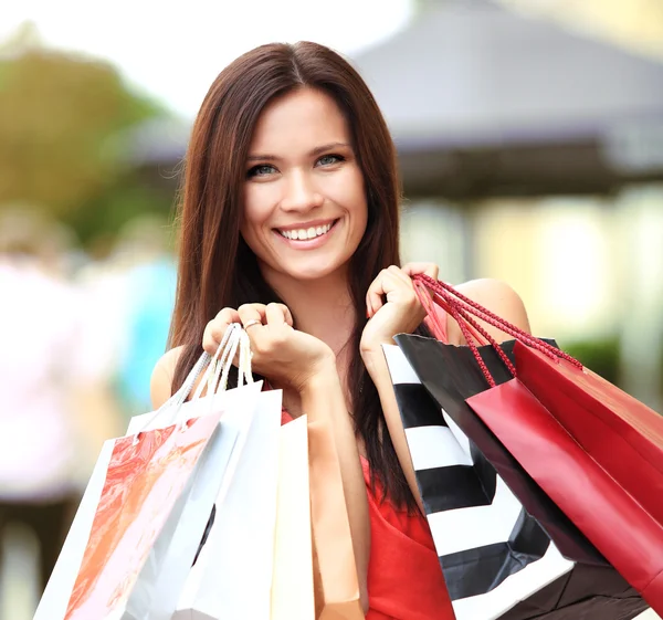 Woman holding bags — Stock Photo, Image