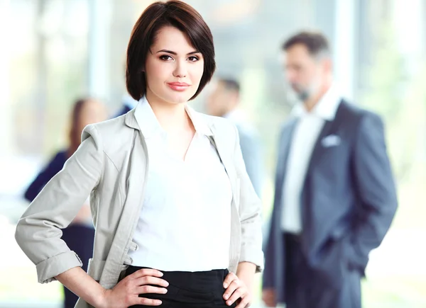 Businesswoman with her staff — Stock Photo, Image