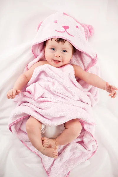 Smiling baby under blanket — Stock Photo, Image