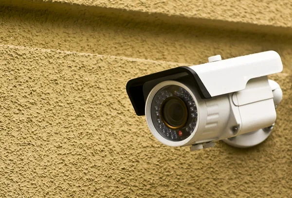 Camera on a brick wall of the house — Stock Photo, Image