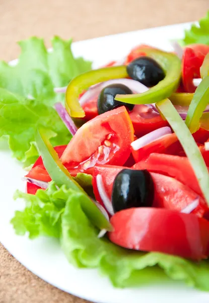 Fresh vegetable salad with olives — Stock Photo, Image