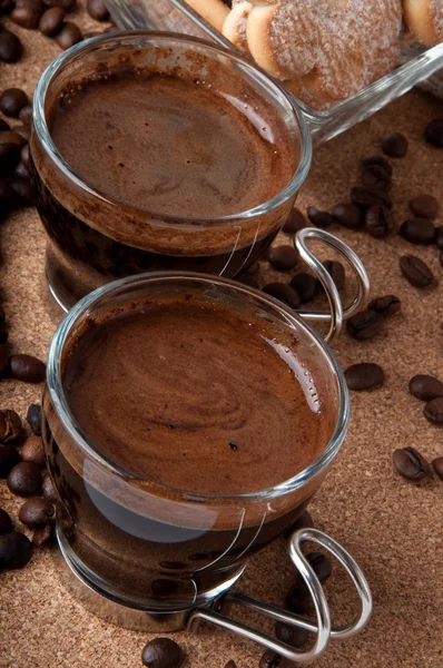 Two cups of black coffee on brown background — Stock Photo, Image