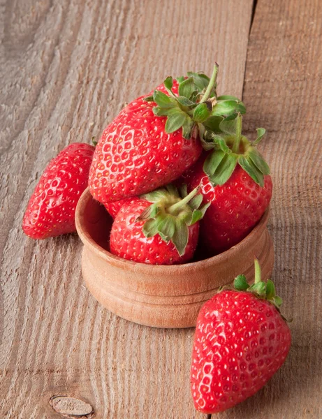 Close up of strawberry on wooden background — Stock Photo, Image