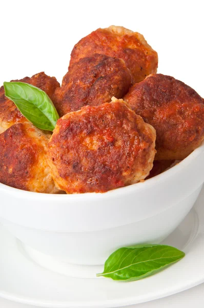 Meatballs in tomato sauce, decorated with leaves of basil — Stock Photo, Image