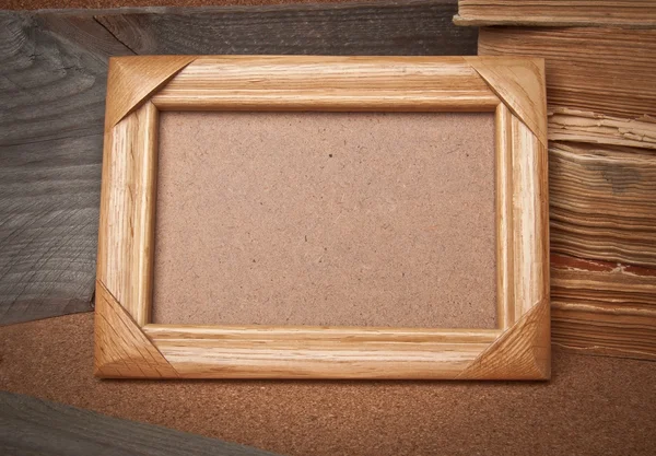 Old photo frame and books on the village background — Stock Photo, Image