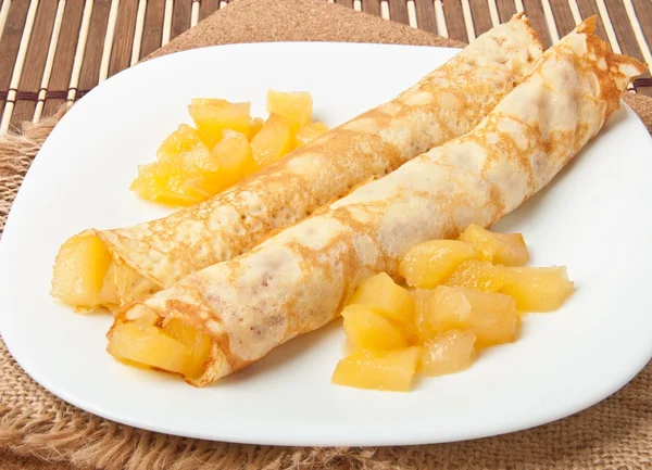 Sweet crepes with apple caramel and cream — Stock Photo, Image