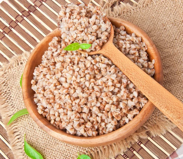 Buckwheat porridge in a wooden bowl — Stock Photo, Image