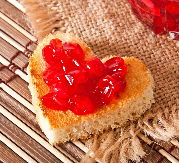 Heart-shaped toast with jam — Stock Photo, Image