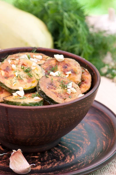 Fried zucchini in an old ceramic bowl — Stock Photo, Image
