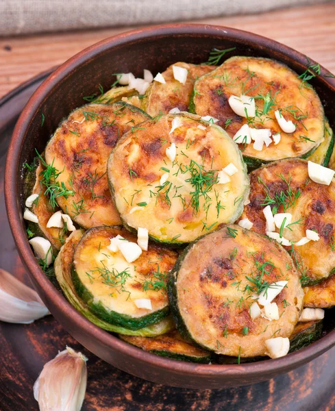 Fried zucchini in an old ceramic bowl — Stock Photo, Image