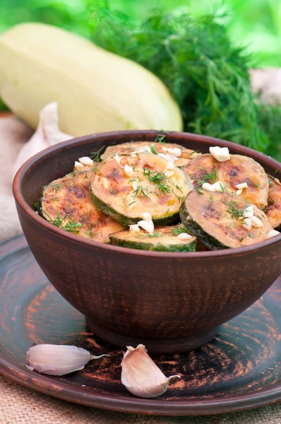 Fried zucchini in an old ceramic bowl — Stock Photo, Image