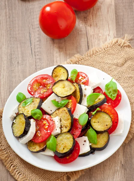 Eggplant salad with tomato and feta cheese — Stock Photo, Image