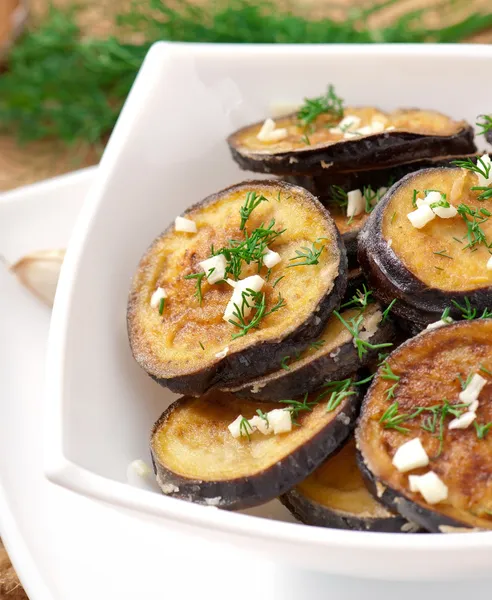 Platter of grilled eggplant with garlic and dill — Stock Photo, Image