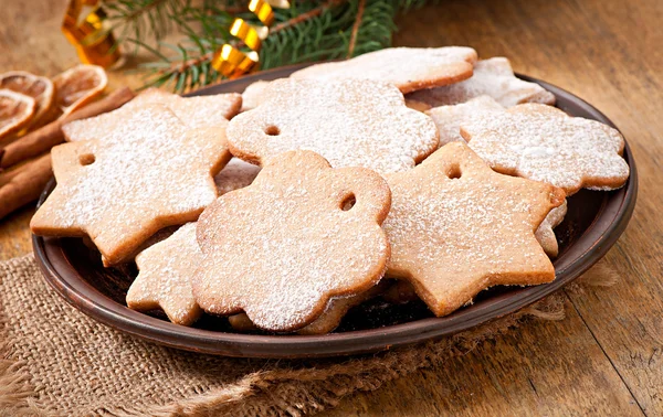 Homemade Christmas cookies sprinkled with powdered sugar — Stock Photo, Image