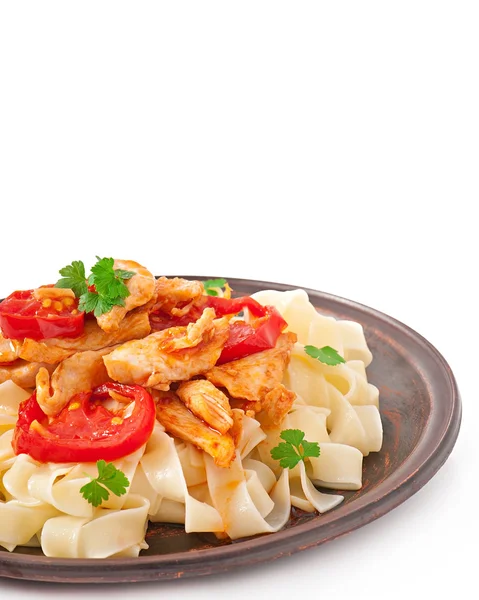 Tagliatelle pasta with tomatoes and chicken — Stock Photo, Image