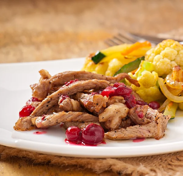 Beef stroganoff with cranberry sauce and grilled vegetables — Stock Photo, Image