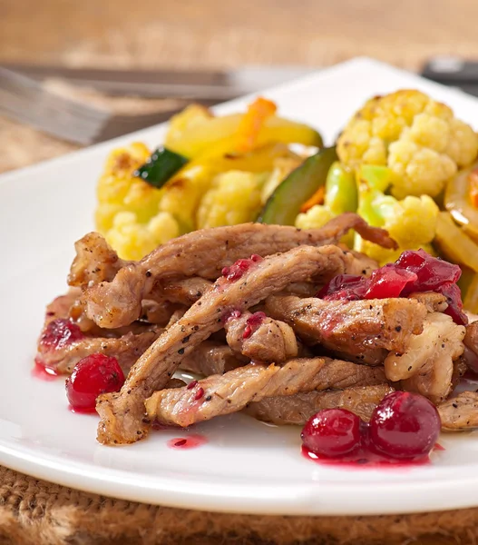 Beef stroganoff with cranberry sauce and grilled vegetables — Stock Photo, Image