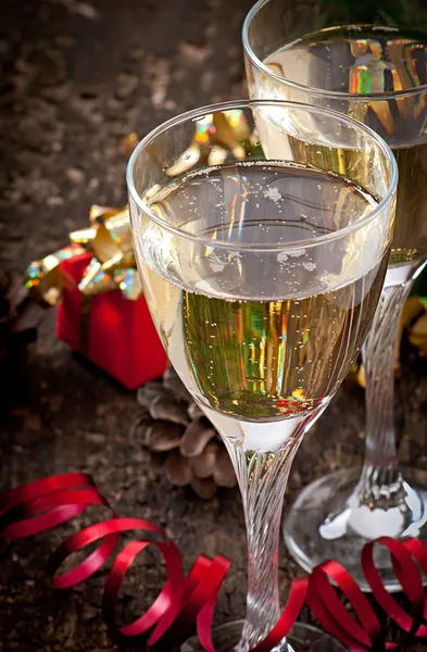 Two glasses of champagne on a dark old wooden background — Stock Photo, Image