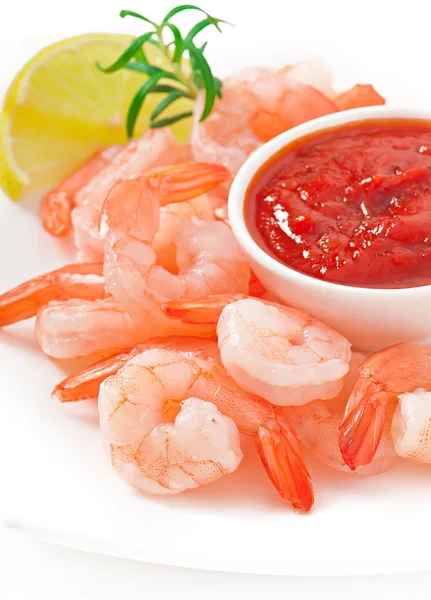 Tails of shrimps with fresh lemon and rosemary in a white plate — Stock Photo, Image